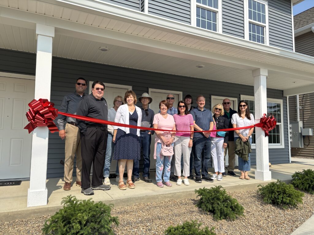 ribbon cutting ceremony opening new affordable housing
