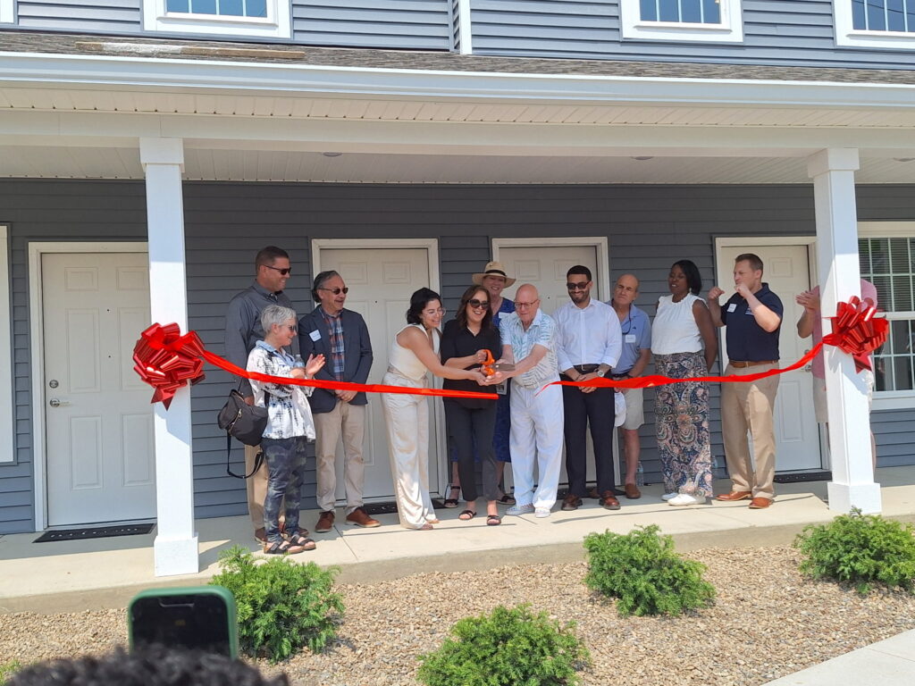 ribbon cutting ceremony opening new affordable housing